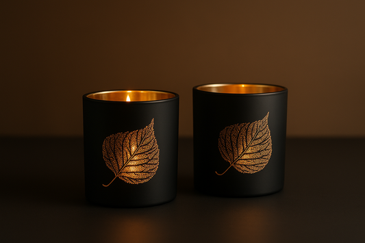 Clean product showcase image of black candles with gold details without text overlay